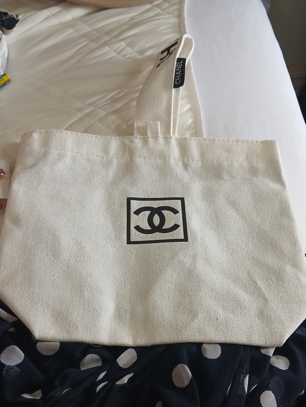 CHANEL Cream Canvas Tote with Black CC Emblem